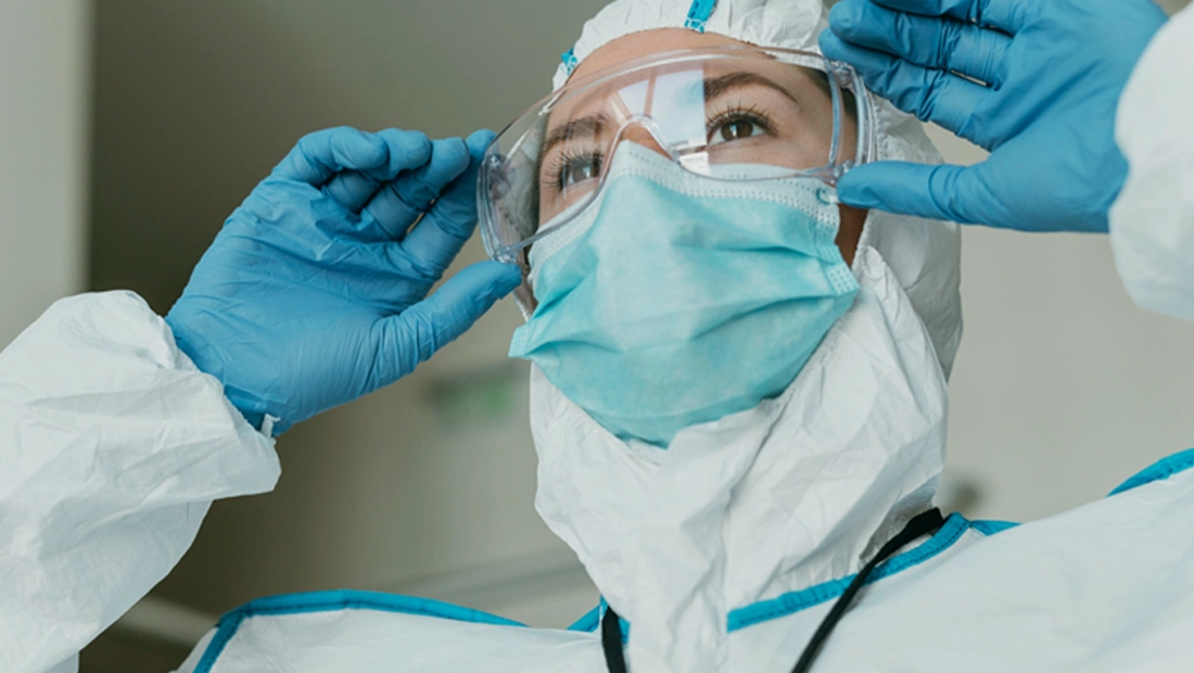 Boxes of medical gloves, syringes, and face masks.
